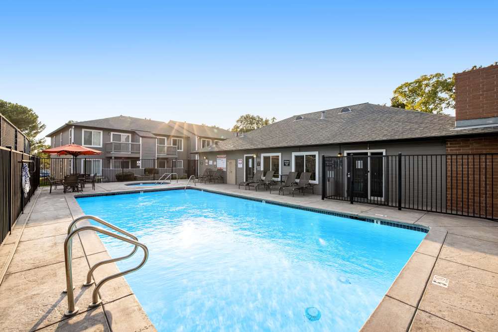 Swimming pool with sundeck at Sandpiper Village Apartment Homes in Vacaville, California