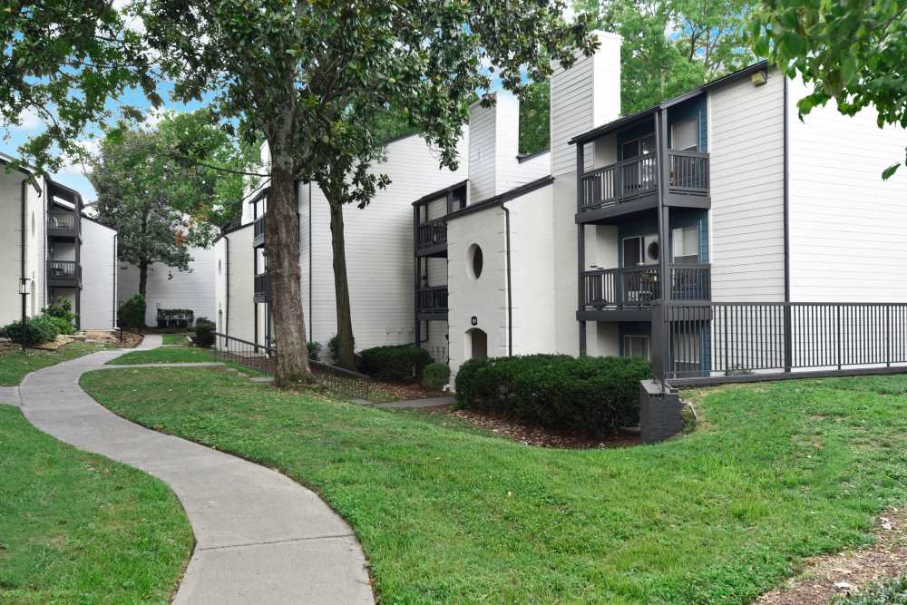 Apartment exterior view with a walking path at The Metropolitan in Nashville, Tennessee