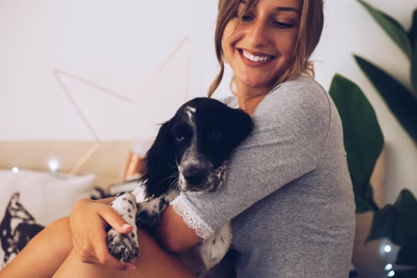 Resident petting her dog at Azul at Spectrum in Gilbert, Arizona