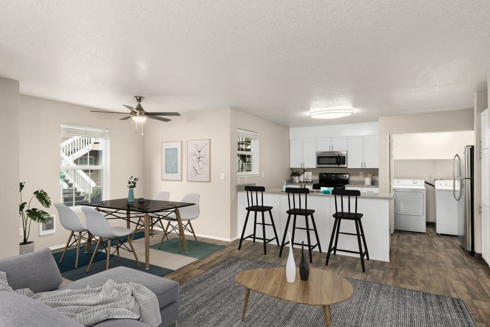 Kitchen overlooking the dining room at Carriage Park Apartments in Vancouver, Washington