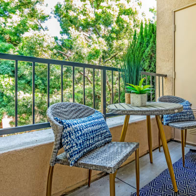 Private balcony overlooking beautiful mature trees outside a resident home at Sofi Shadowridge in Vista, California