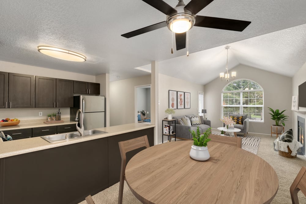 A beautiful open layout floor plan with the kitchen overlooking the living room at Carriage Park Apartments in Vancouver, Washington