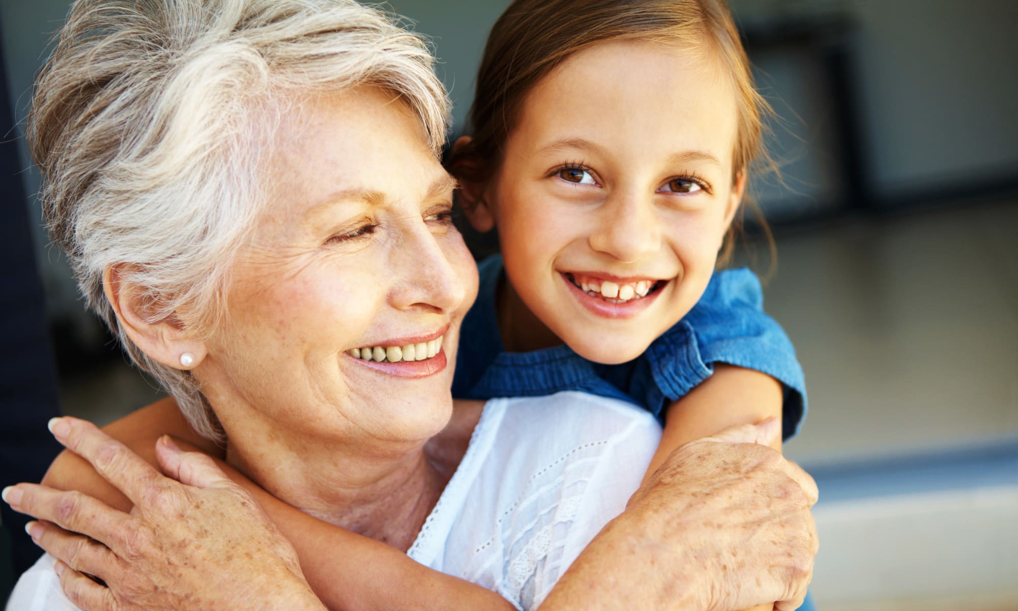 A Child riding on the back of a resident at a Retirement Center Management community