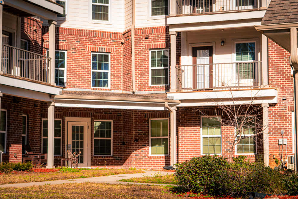 View of exterior of apartments at Redland Creek in Lawrenceville, Georgia