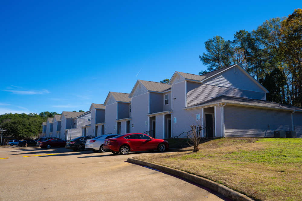 Exterior of the apartments with car parking at Ryan's Crossing in Marshall, Texas