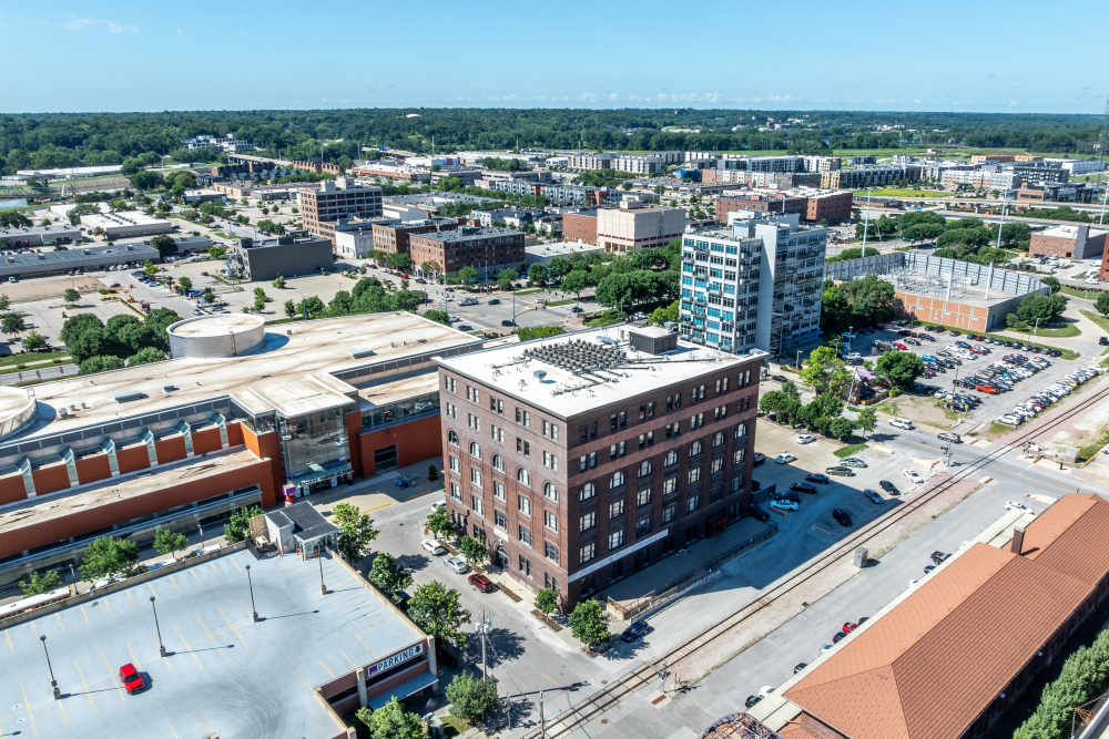 Aerial view of buildings and parking lots at Rumely Lofts in Des Moines, Iowa