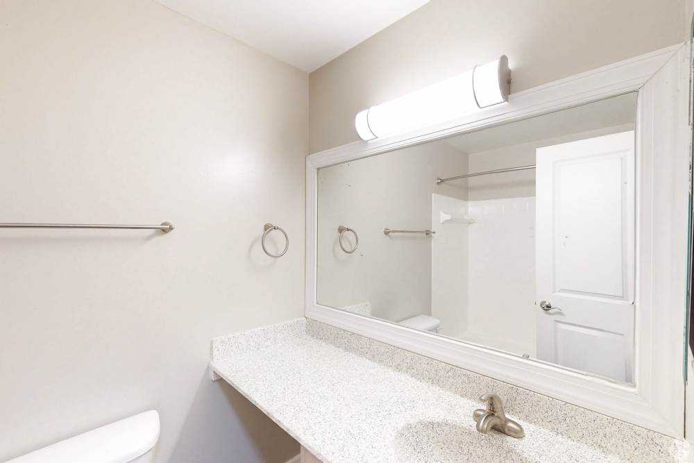 Bathroom with large mirror at Knights Bridge II in Burtonsville Maryland
