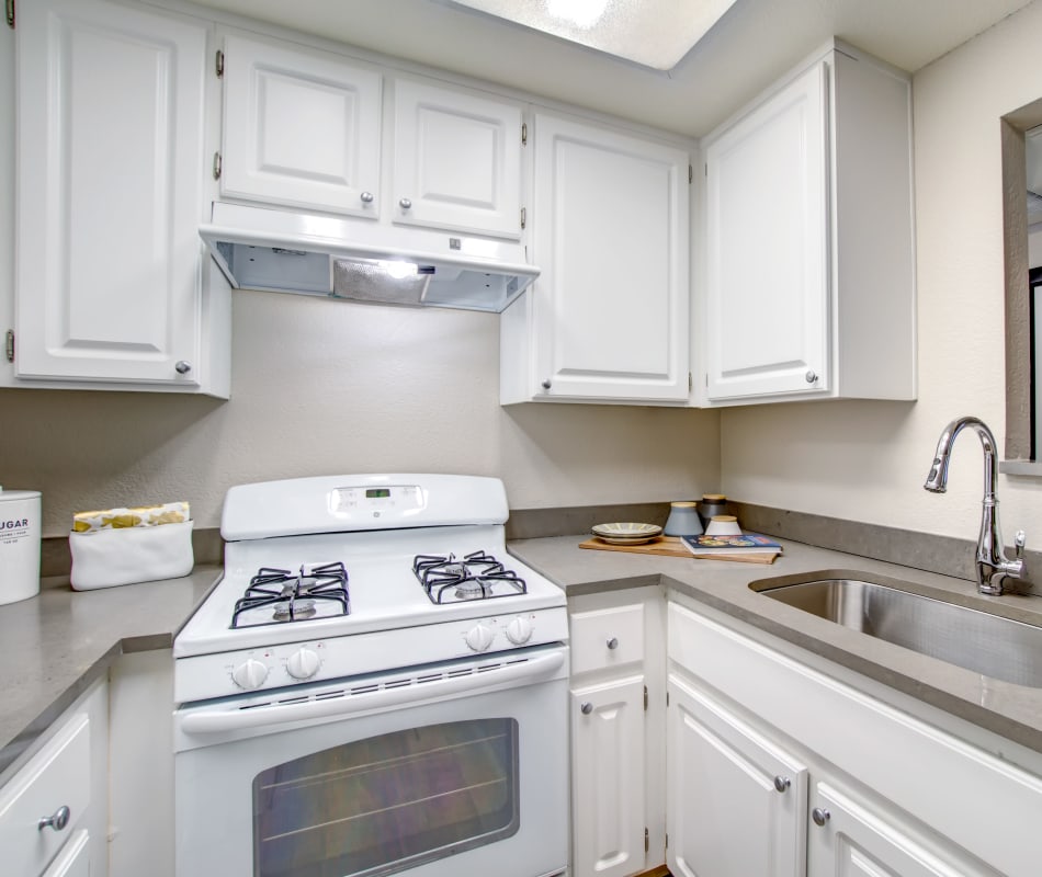 Modern kitchen with a breakfast bar in a model home at Vue Fremont in Fremont, California