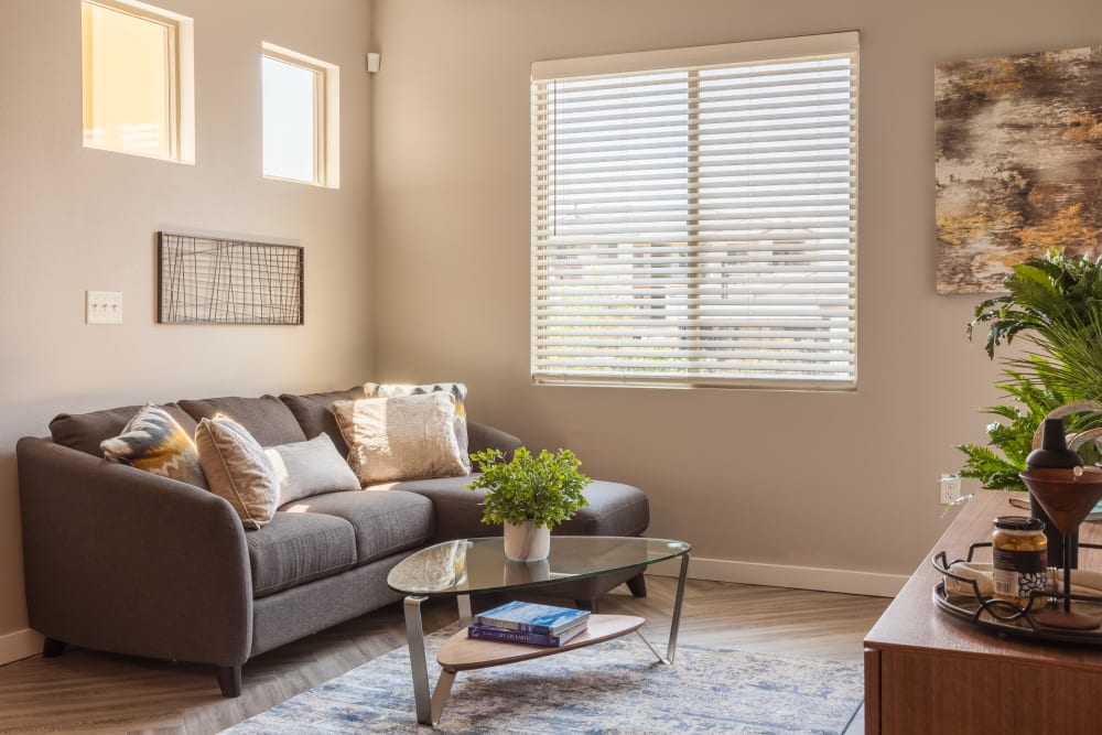 Open-concept living area with herringbone-style flooring in a model home at Olympus Alameda in Albuquerque, New Mexico