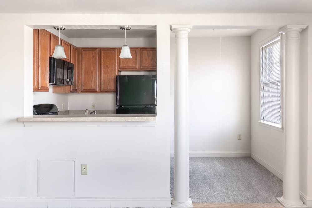 Kitchen with breakfast countertop at Dundalk Village in Dundalk, Maryland