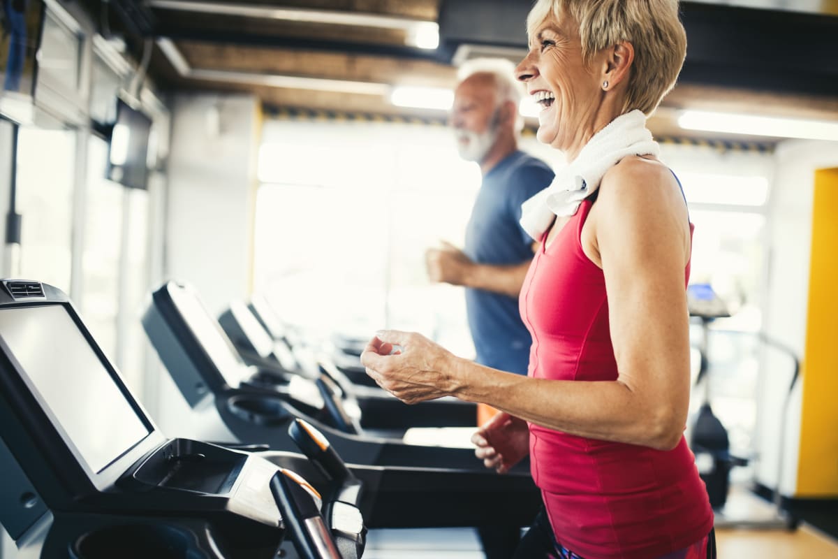 Resident enjoying the modern gym at The Residences at NEWCITY in Chicago, Illinois