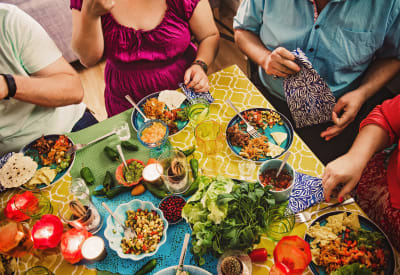 Residents enjoying a fabulous feast at their favorite restaurant near 505 West Apartment Homes in Tempe, Arizona