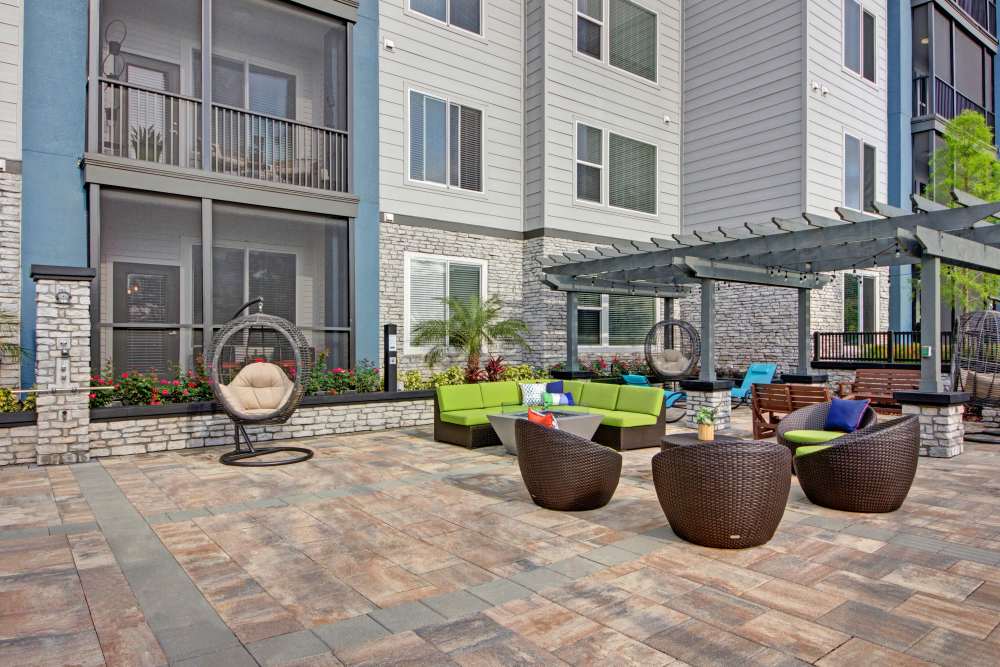 Outdoor lounge area with seating at The Courtney at Lake Shadow in Orlando, Florida 