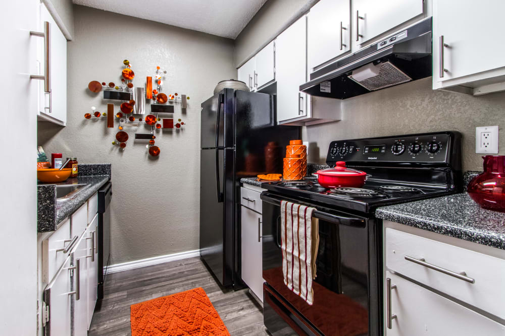 Fully equipped model kitchen at Sausalito Apartments in College Station, Texas