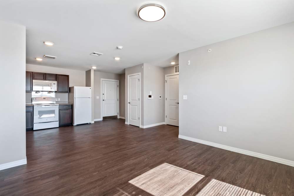 LVT floored living space and open kitchen at Barley Square Apartments in Reading, Pennsylvania