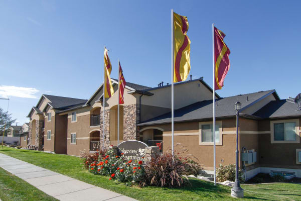 Exterior of apartments with sign at Ridgeview Apartments