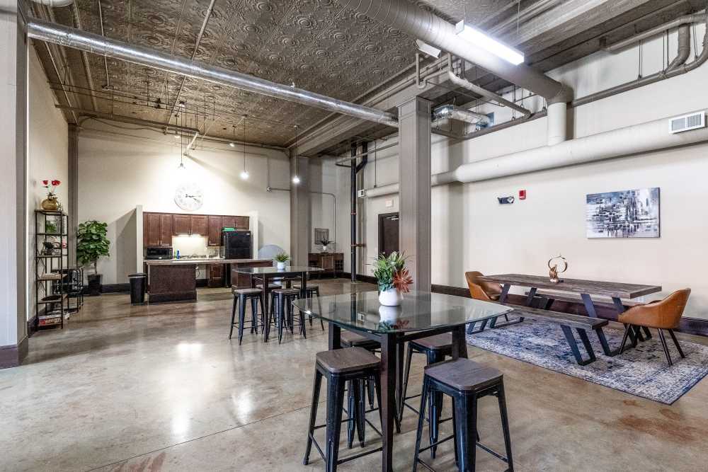 Tables and chairs arranged in open space at Rumely Lofts in Des Moines, Iowa