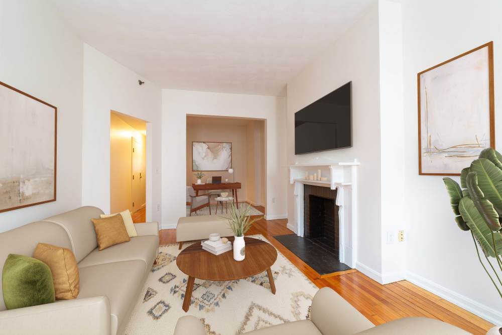 Garden style light-colored sofa with decorative pillows at 15-25 Hemenway Apartments in Boston, Massachusetts