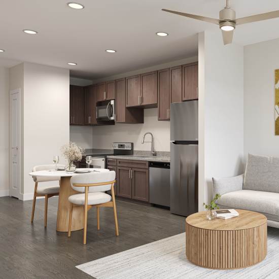Kitchen with granite countertop and stainless-steel appliances at The Cascade at Foundry Creek in Richmond, Virginia