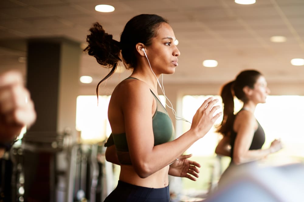 A resident running at her community gym at Goldelm at Metropolitan in Knoxville, Tennessee