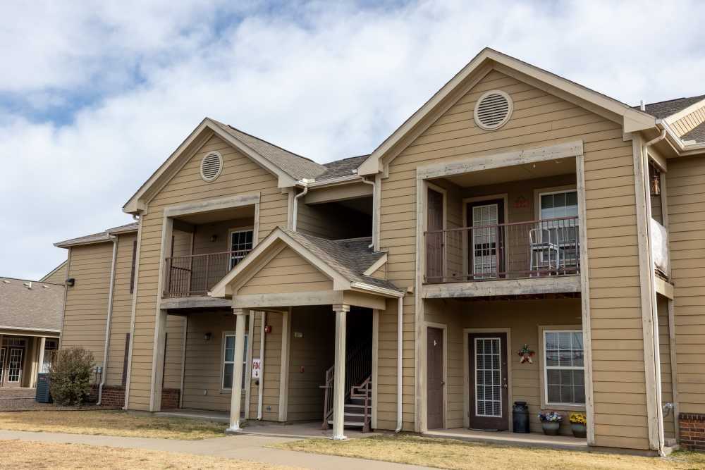 Charming two-story apartment with inviting balconies and well-maintained exterior at Adobe Ranch in Borger, Texas.