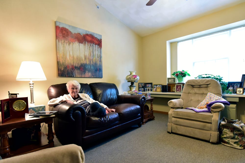 Resident in her living room in senior living apartment at Garden Place Millstadt in Millstadt, Illinois