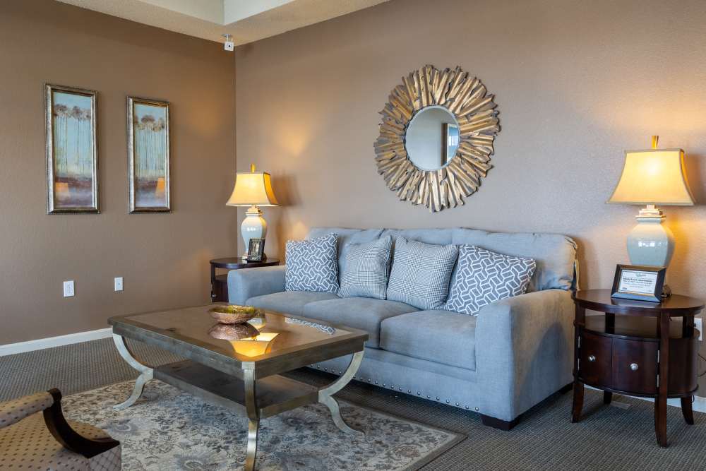 Charming living area featuring a cozy sofa, elegant decor, and warm lighting at Adobe Ranch in Borger, Texas.