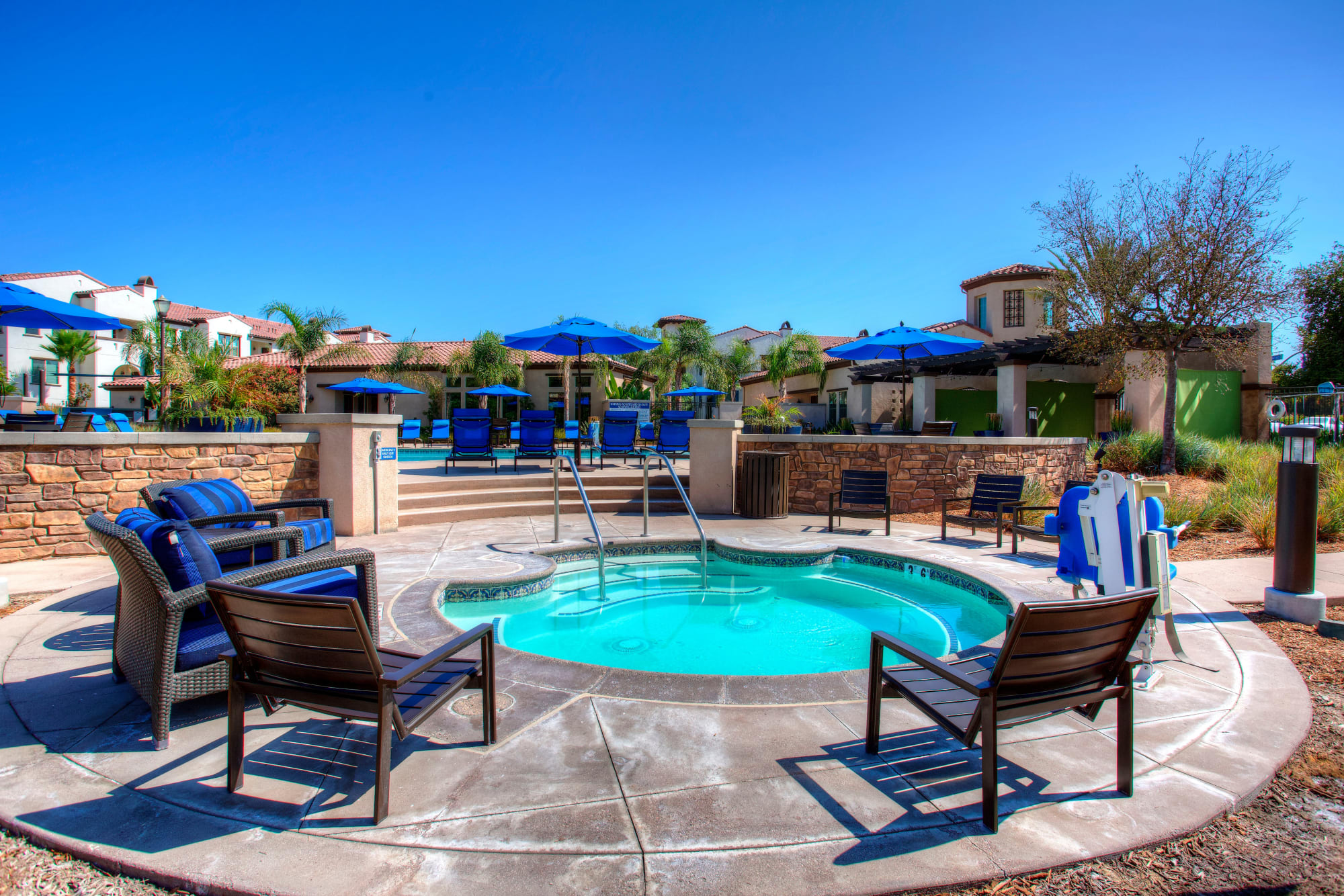 Deck chairs around the hot tub at Palisades Sierra Del Oro in Corona, California