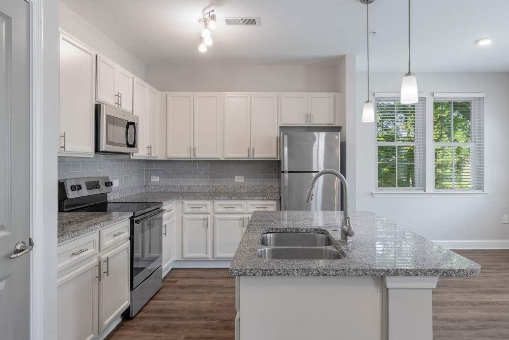 Stainless steel appliances and granite countertops in kitchen at Charthouse at James Island in Charleston, South Carolina