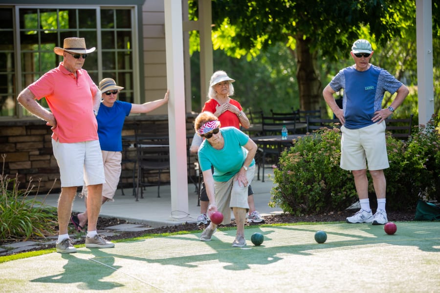 Residents playing an outdoor game at Touchmark at Coffee Creek in Edmond, Oklahoma