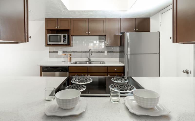 Espresso cabinets in a kitchen at Windgate Apartments in Bountiful, Utah