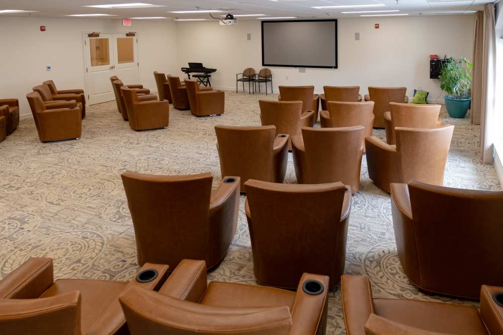 Indoor theater with recliners at The Harmony Collection at Roanoke - Assisted Living in Roanoke, Virginia