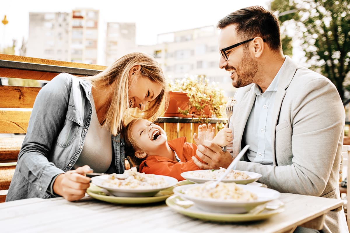 Couple having dinner with child outdoors in Fort Worth, Texas from Marquis at Stonegate