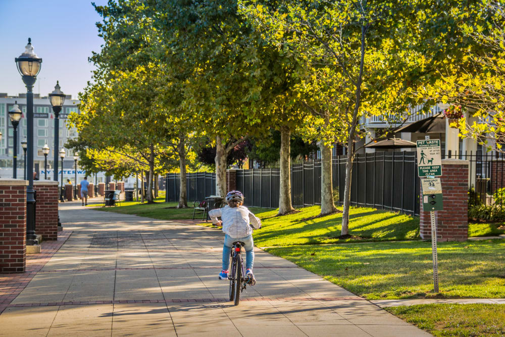 Resident biking near Riverbend at Port Imperial in West New York, New Jersey