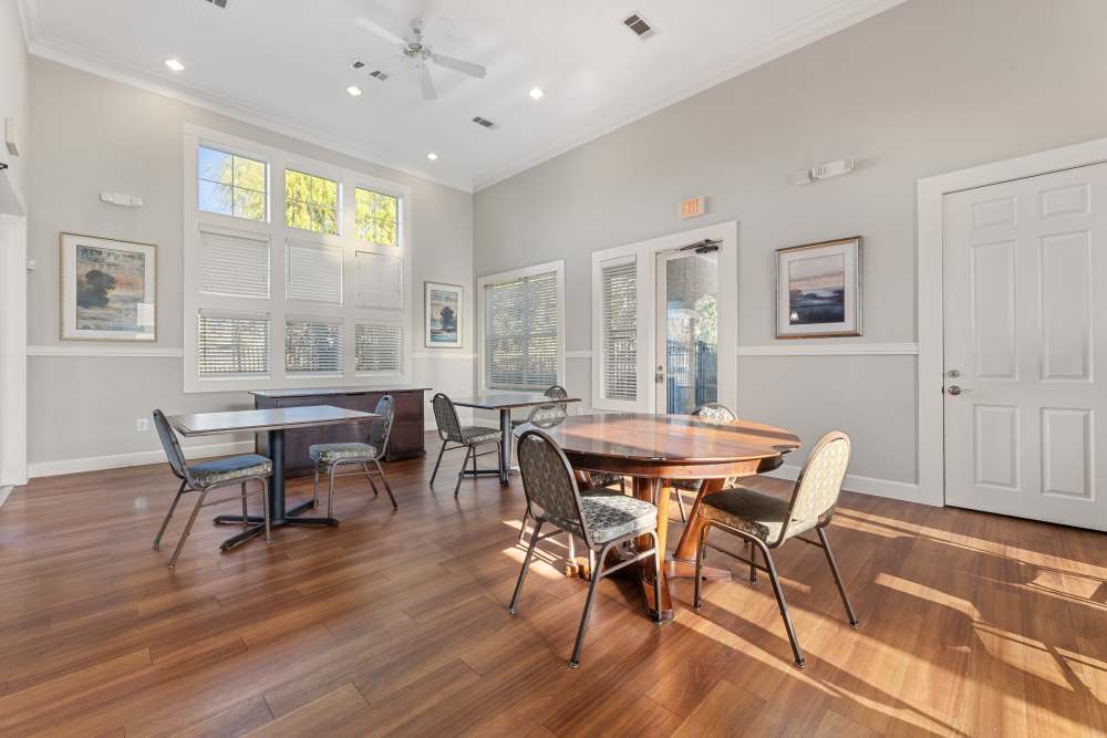 Community room with tables and chairs at Costa Ibiza in Houston, Texas