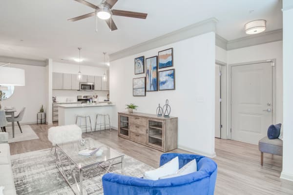 A furnished apartment living room and dining room at Bradley Park Apartments in Cumming, Georgia