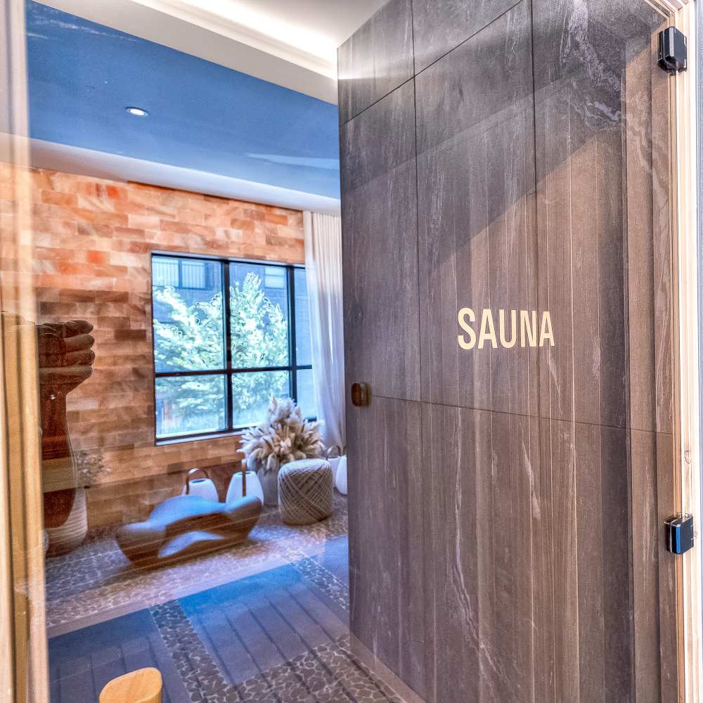 Modern gym with natural greenery and high-quality fitness equipment at Green|House Short North in Columbus, Ohio