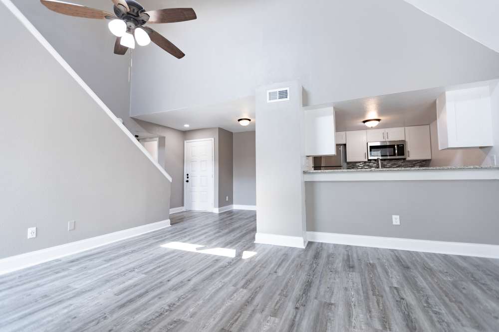 Unfurnished living room with staircase at Hubbards Ridge in Garland, Texas