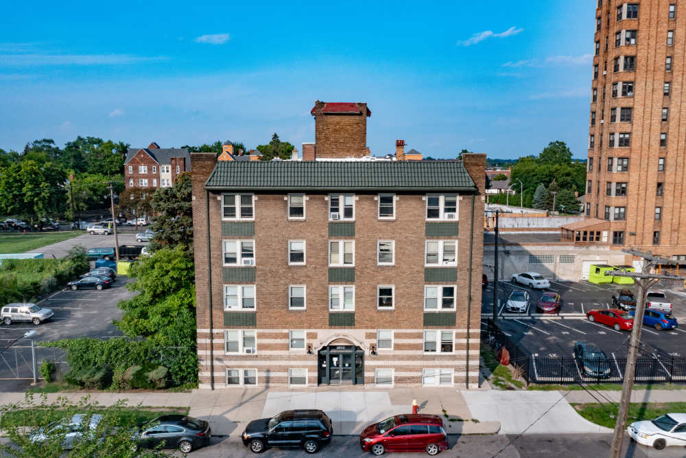 Aerial view of the building and parking lot at Detroit Living in Detroit, Michigan