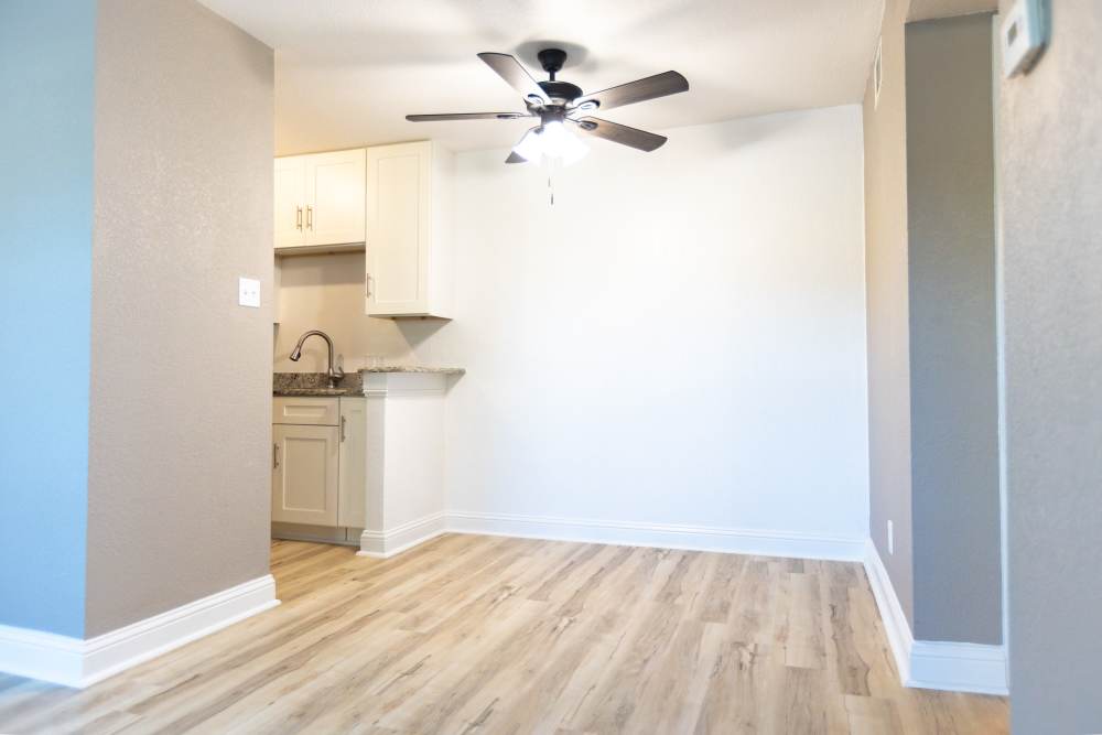 Unfurnished dining room with view to kitchen at Lakeshore Villa Apartments in Rowlett, Texas
