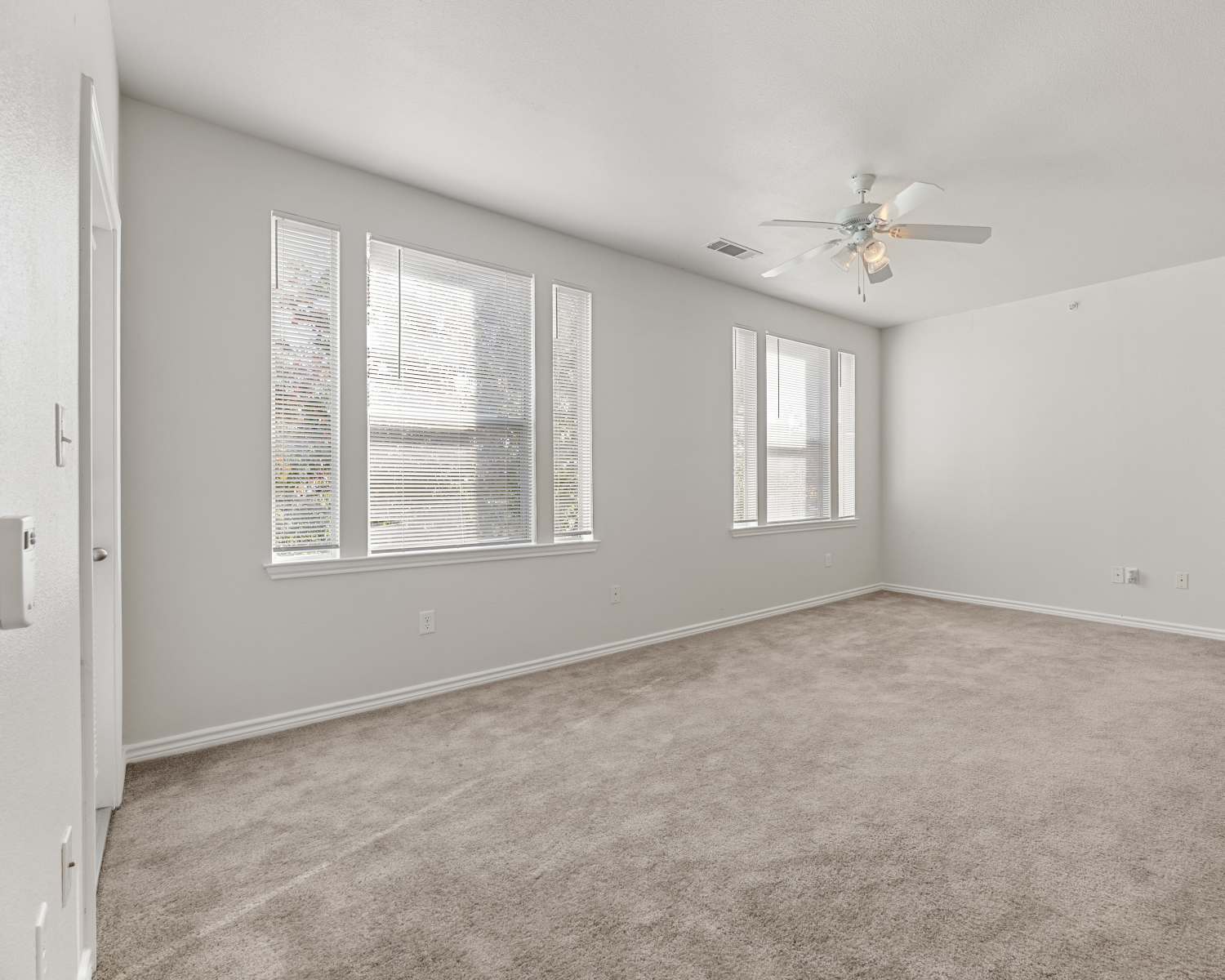 Unfurnished living room with carpet flooring at Costa Ibiza in Houston,Texas
