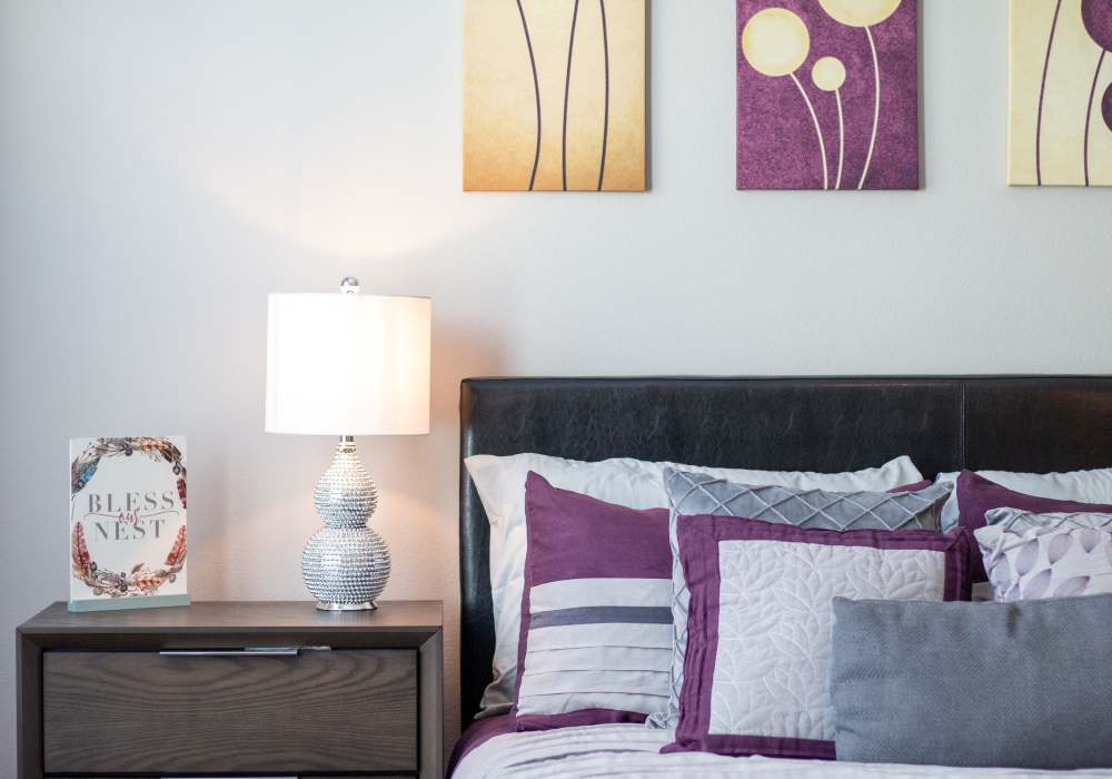 Bedroom with comfortable bed,  and wooden storage cabinets at The Bammel in Houston, Texas