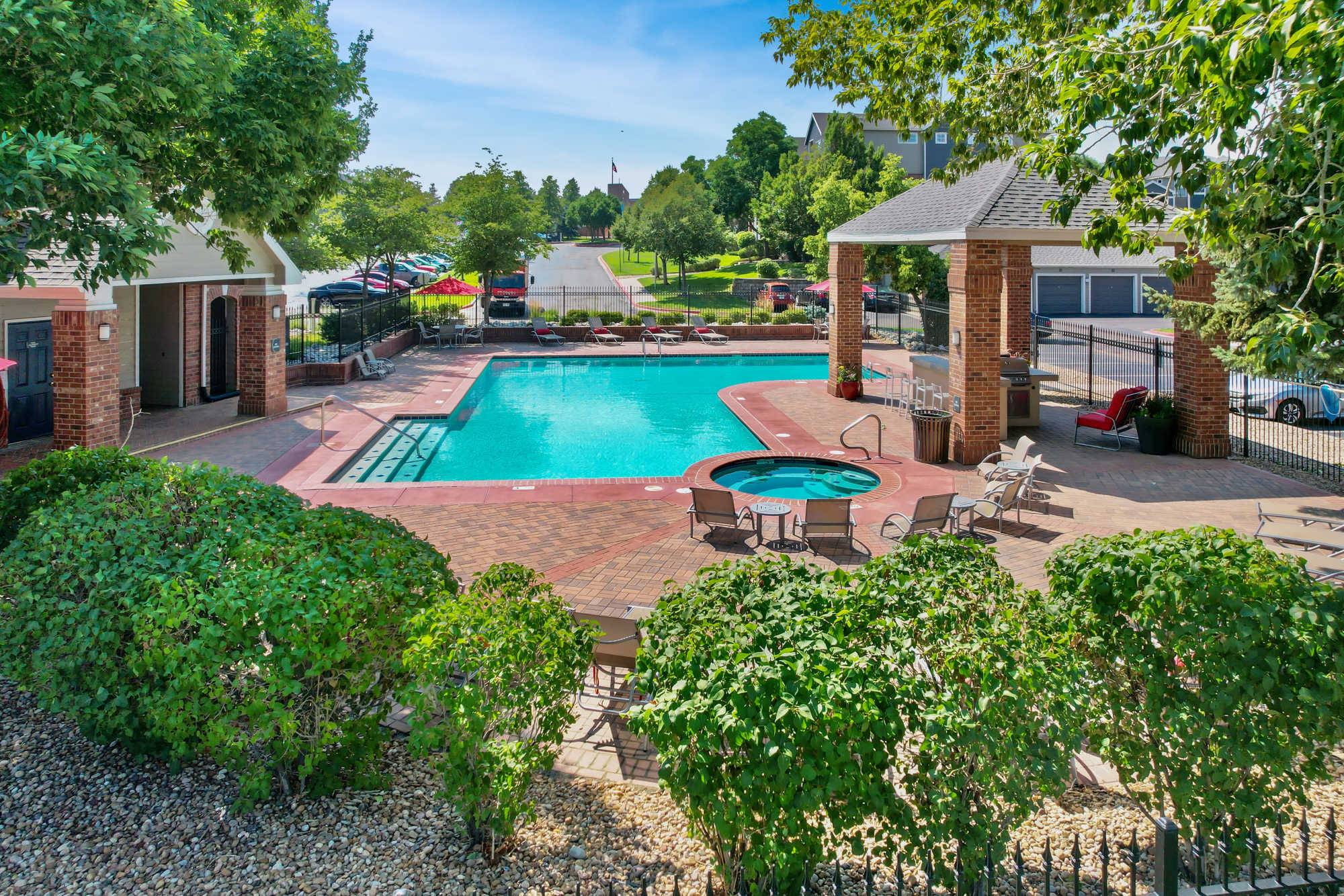 Sparkling pool with hot tub at Promenade at Hunter's Glen Apartments in Thornton, Colorado