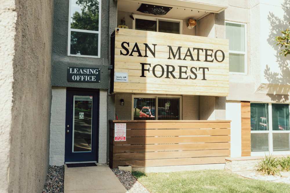 Charming leasing office amidst lush landscaping at San Mateo Forest in Dallas, Texas