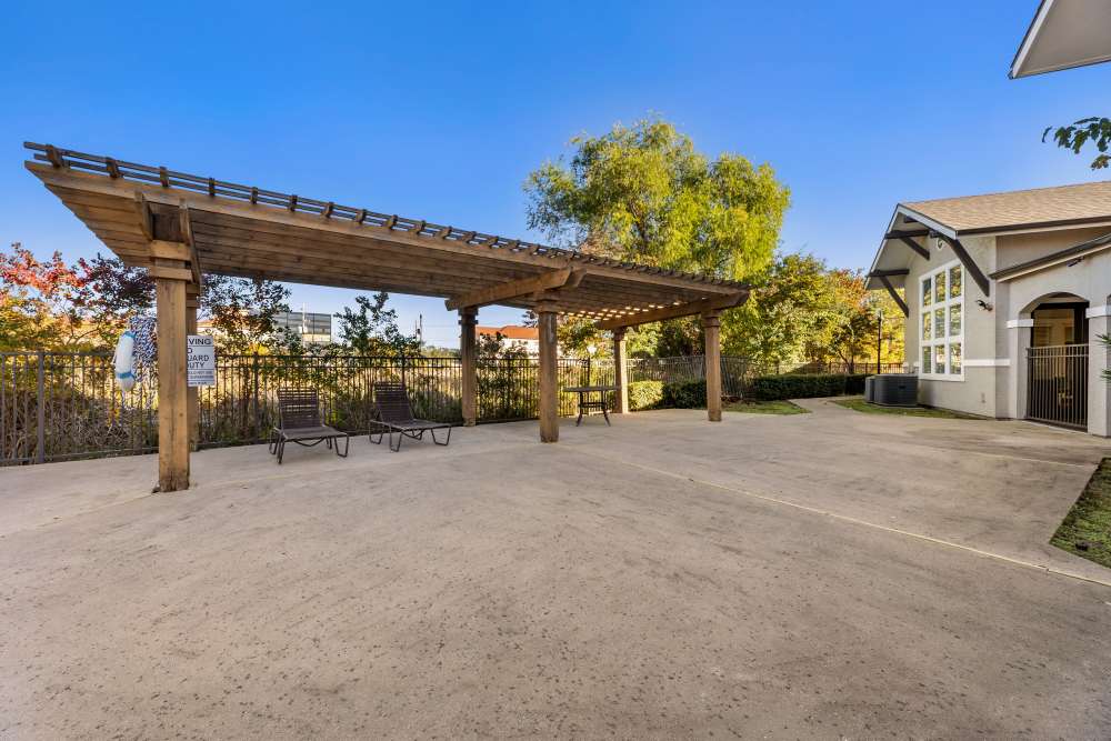 An outdoor covered sitting area at Costa Ibiza in Houston, Texas
