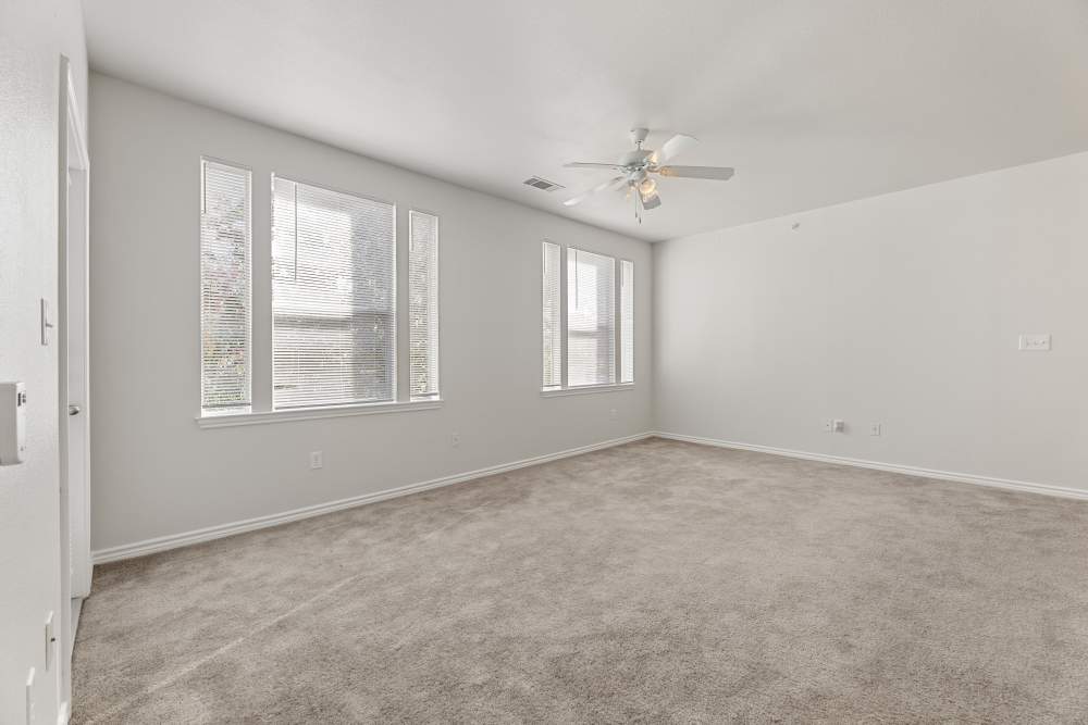 Living room with big windows at Costa Ibiza in Houston, Texas