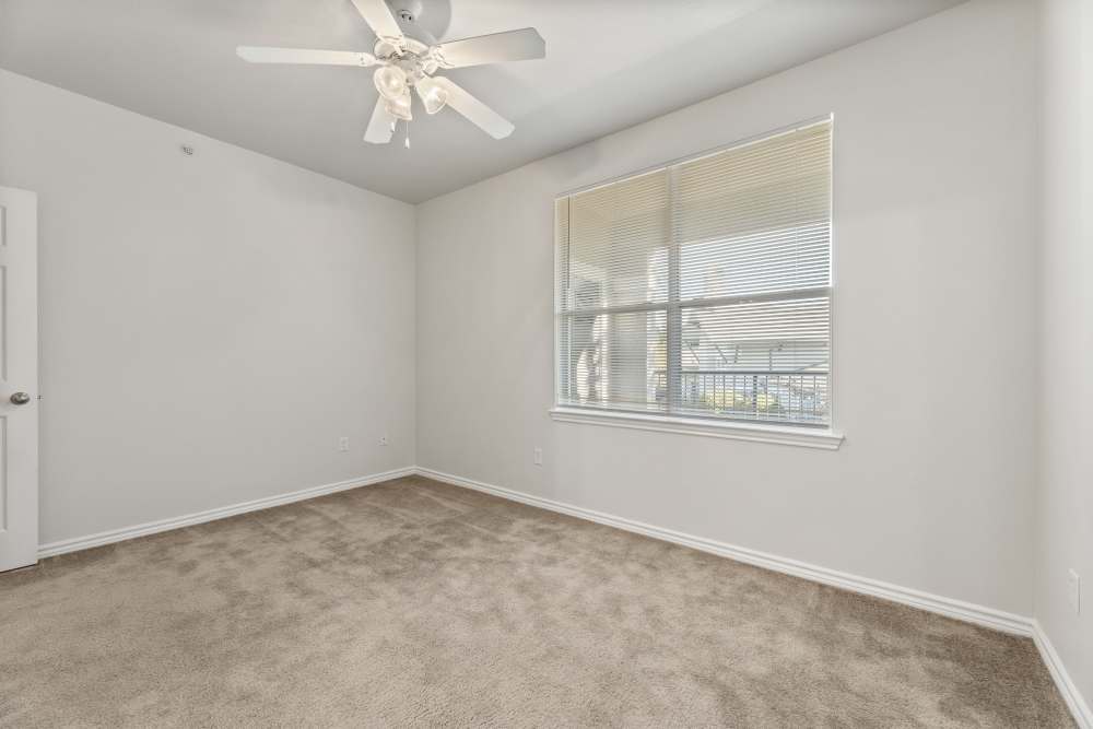 A view of a bedroom with a window at Costa Ibiza in Houston, Texas