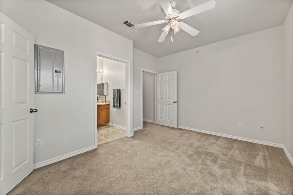 Bedroom with attached bathroom at Costa Ibiza in Houston, Texas