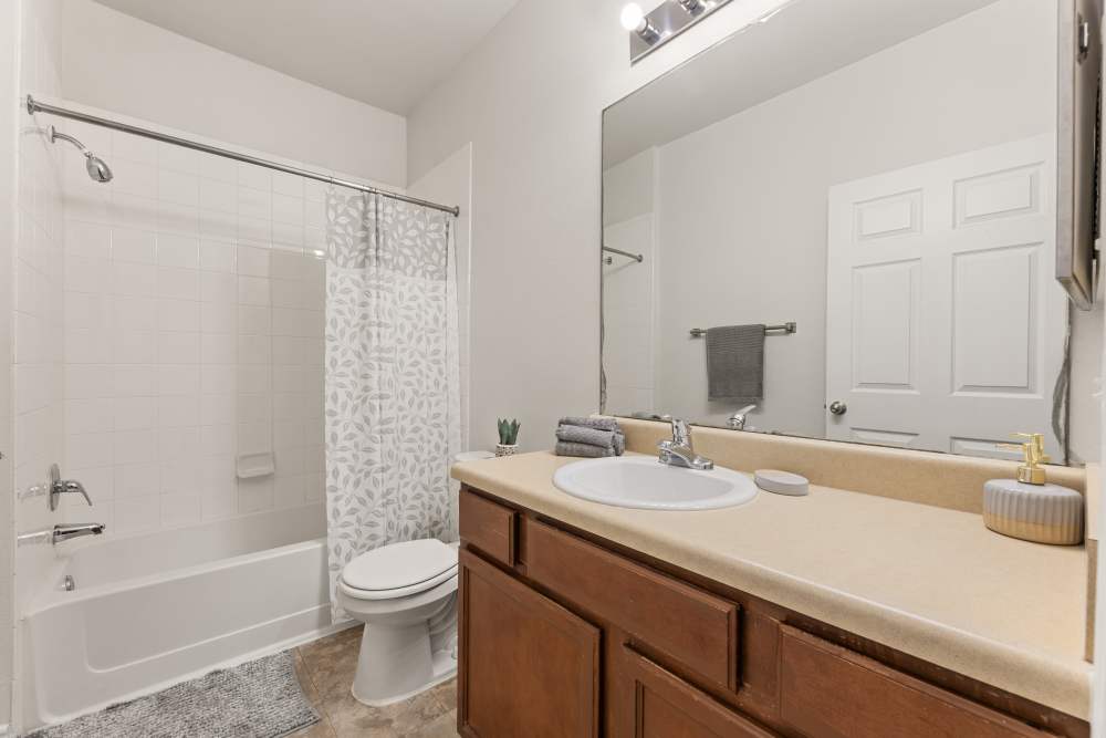 Bathroom with shower and tub at Costa Ibiza in Houston, Texas