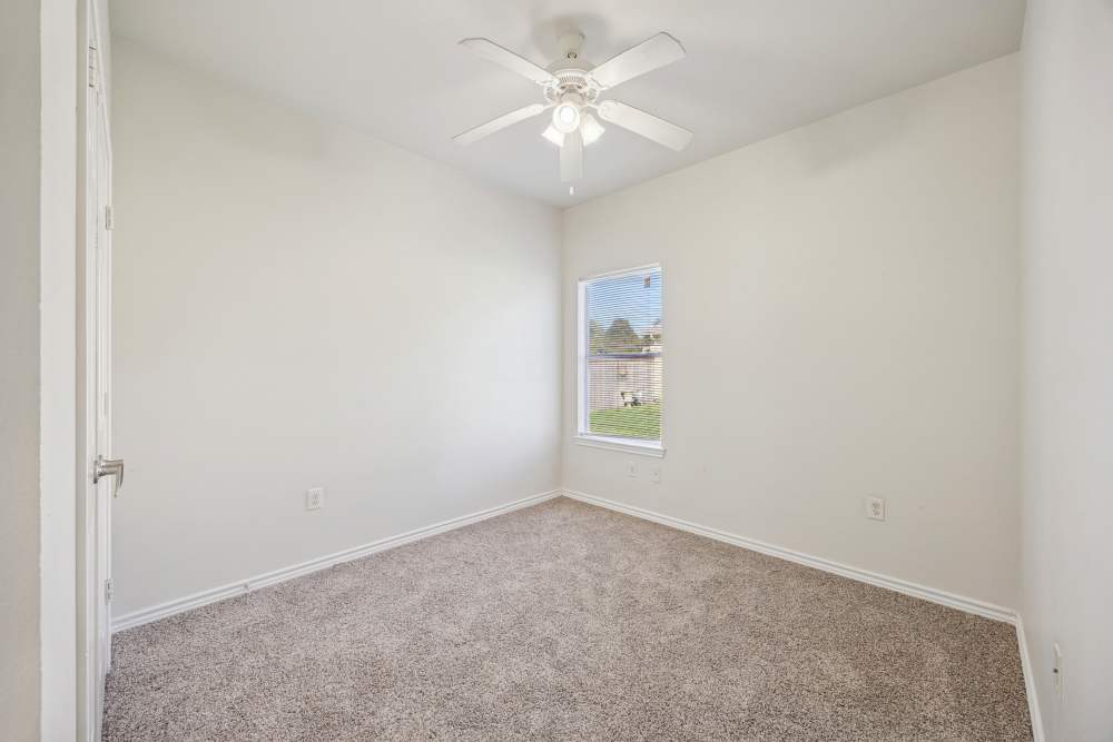 Bedroom with carpet flooring at Casa Brazoria in Clute, Texas